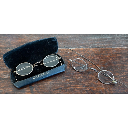 501 - A pair of early 19th century steel-framed spectacles, to/w another pair of antique gilt metal specta... 