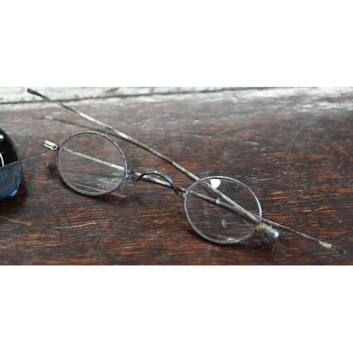 501 - A pair of early 19th century steel-framed spectacles, to/w another pair of antique gilt metal specta... 