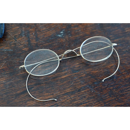 501 - A pair of early 19th century steel-framed spectacles, to/w another pair of antique gilt metal specta... 