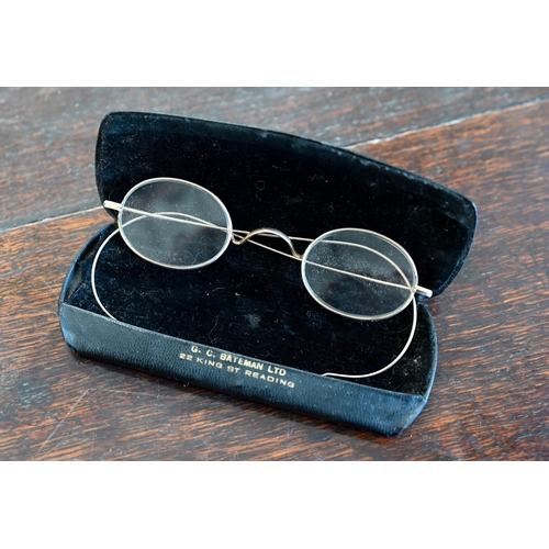 501 - A pair of early 19th century steel-framed spectacles, to/w another pair of antique gilt metal specta... 