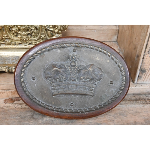 506 - An oval brass plaque cast with a Royal crown to/w a brass inkstand/stationery rack, a brass hand-bel... 