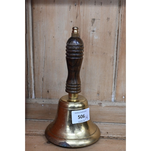 506 - An oval brass plaque cast with a Royal crown to/w a brass inkstand/stationery rack, a brass hand-bel... 