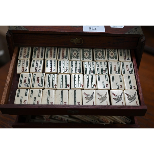 513 - An antique bone and bamboo Mah Jong set, in brass-mounted teak fitted case with five drawers (replac... 