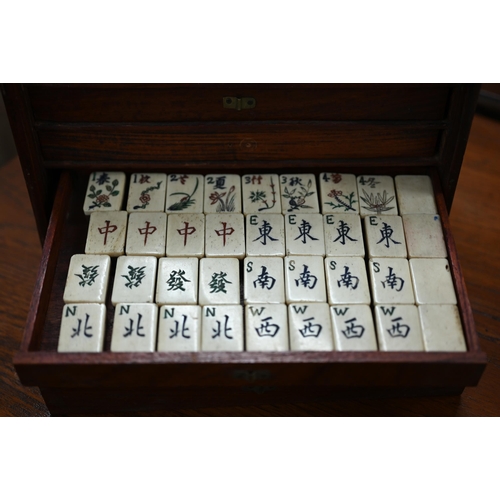 513 - An antique bone and bamboo Mah Jong set, in brass-mounted teak fitted case with five drawers (replac... 