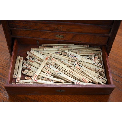 513 - An antique bone and bamboo Mah Jong set, in brass-mounted teak fitted case with five drawers (replac... 