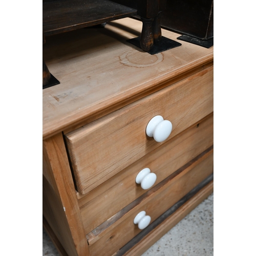 52 - An old beech three drawer chest of three long drawers