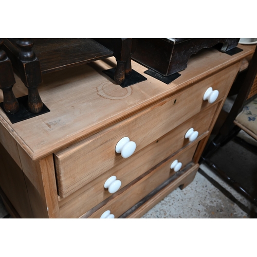 52 - An old beech three drawer chest of three long drawers