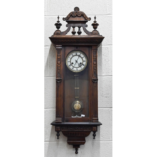 530 - # A German carved walnut Vienna-style wall clock, 98cm high