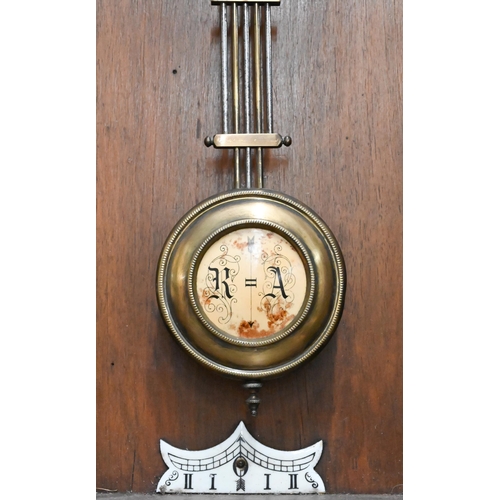 530 - # A German carved walnut Vienna-style wall clock, 98cm high