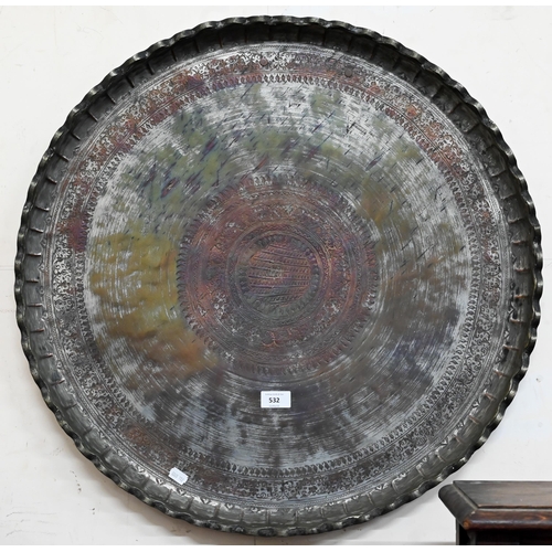 532 - A large antique Middle Eastern copper tray with engraved decoration and vestigial silver-plating, 67... 