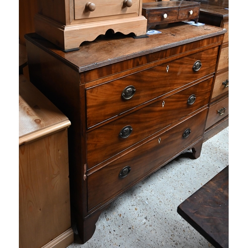 56 - A George III mahogany chest of three long graduated drawers, bone escutcheons, raised on shaped brac... 