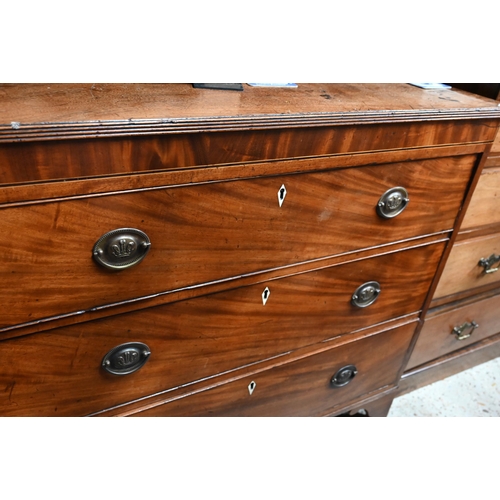 56 - A George III mahogany chest of three long graduated drawers, bone escutcheons, raised on shaped brac... 