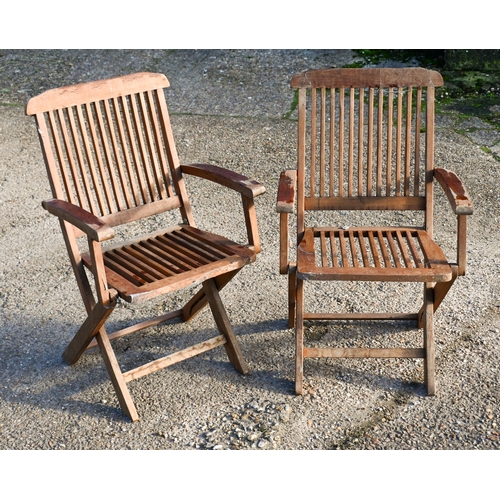 6 - A weathered teak garden table and four folding chairs (5)