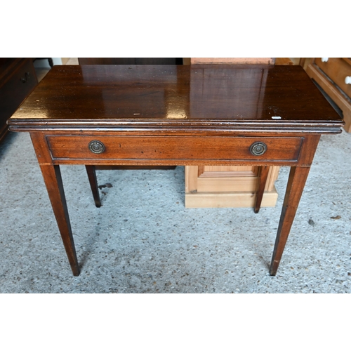 64 - A Victorian mahogany fold over double gateleg tea table, with single frieze drawer, raised on square... 