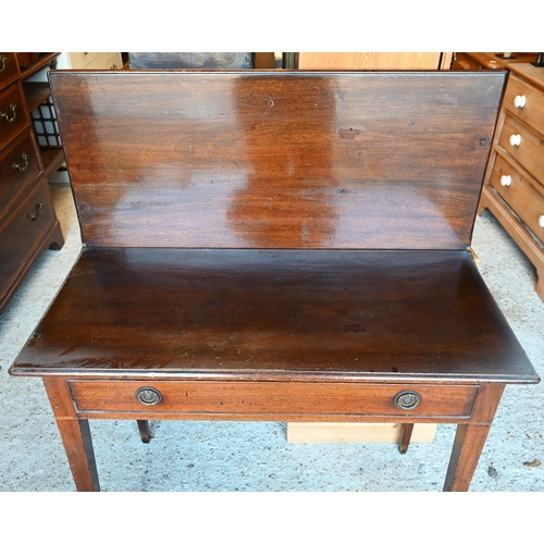 64 - A Victorian mahogany fold over double gateleg tea table, with single frieze drawer, raised on square... 