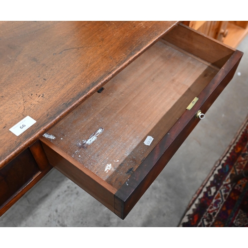 66 - An antique mahogany dressing table with two drawers and turned supports, 114 cm w x 60 cm d x 80 cm ... 