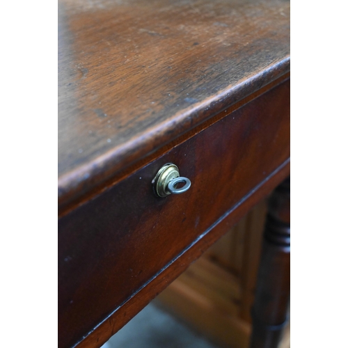 66 - An antique mahogany dressing table with two drawers and turned supports, 114 cm w x 60 cm d x 80 cm ... 