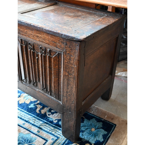 67 - An antique oak linenfold carved coffer, panelled construction with hinged top, 110 cm w x 50 cm d x ... 