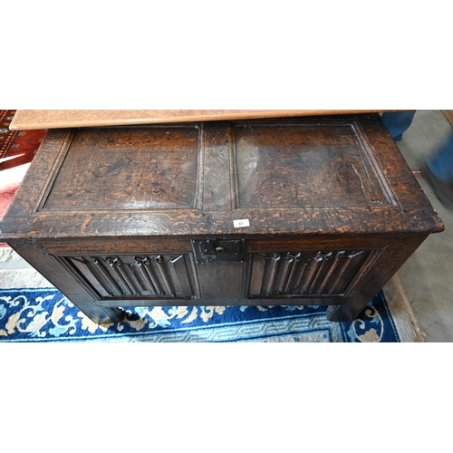 67 - An antique oak linenfold carved coffer, panelled construction with hinged top, 110 cm w x 50 cm d x ... 