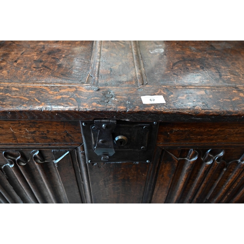 67 - An antique oak linenfold carved coffer, panelled construction with hinged top, 110 cm w x 50 cm d x ... 