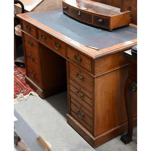 70 - Jas Shoolbred & Co (stamped) - a late Victorian walnut twin pedestal desk with nine drawers, 120... 