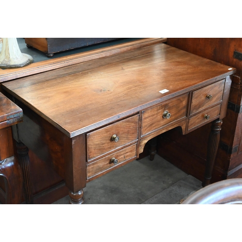 74 - A 19th century mahogany dressing table with five drawers, on turned and reeded supports, 90 cm w x 4... 