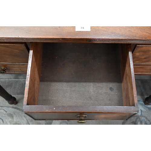 74 - A 19th century mahogany dressing table with five drawers, on turned and reeded supports, 90 cm w x 4... 