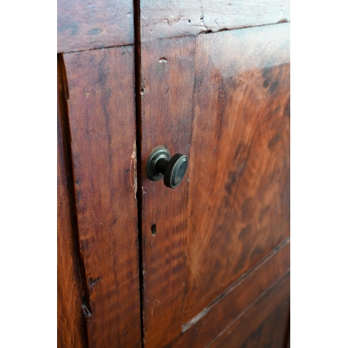 76 - A scumbled pine two-section pantry cupboard with four panelled doors enclosing shelves, 105 cm w x 5... 