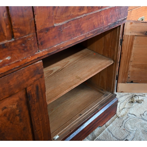 76 - A scumbled pine two-section pantry cupboard with four panelled doors enclosing shelves, 105 cm w x 5... 