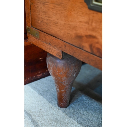 77 - A teak and brass mounted campaign style chest with arrangement of ten drawers with recessed handles,... 