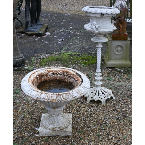 8 - A weathered cast stone garden cast urn planter raised on a square plinth to/with a Victorian style p... 