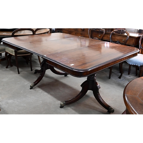 80 - A 19th century mahogany extending dining table, the moulded top with single central leaf raised on t... 