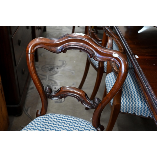 81 - A Harlequin set of six Victorian rosewood balloon back dining chairs with blue and cream herringbone... 