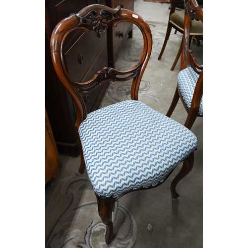 81 - A Harlequin set of six Victorian rosewood balloon back dining chairs with blue and cream herringbone... 