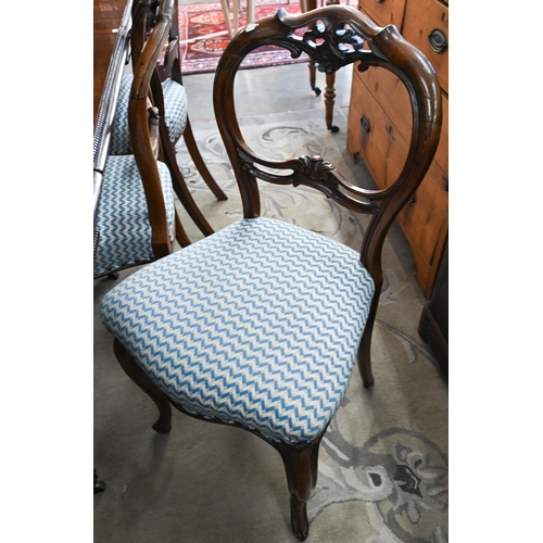 81 - A Harlequin set of six Victorian rosewood balloon back dining chairs with blue and cream herringbone... 