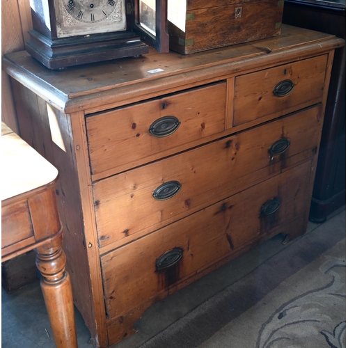 83 - An antique stained pine chest of two short over two long drawers with brass handles, 100 cm w x 42 c... 