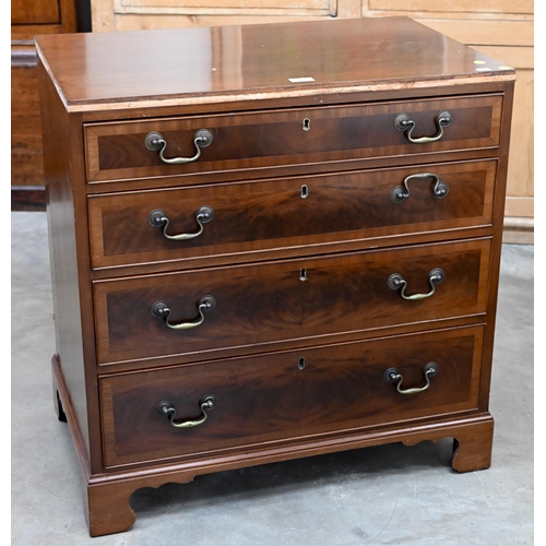 86 - A George III style reproduction chest of four long graduating drawers on shaped bracket feet, 75 cm ... 