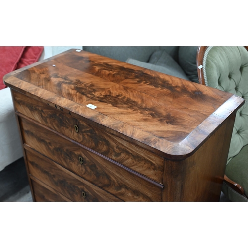 87 - A 19th century figured mahogany chest of four long drawers below the moulded quarter veneered top, 9... 