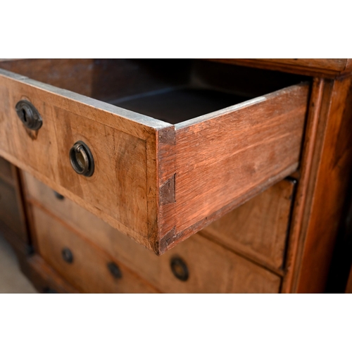 89 - An 18th century and later oak and walnut chest of two short over three long drawers on bracket feet,... 