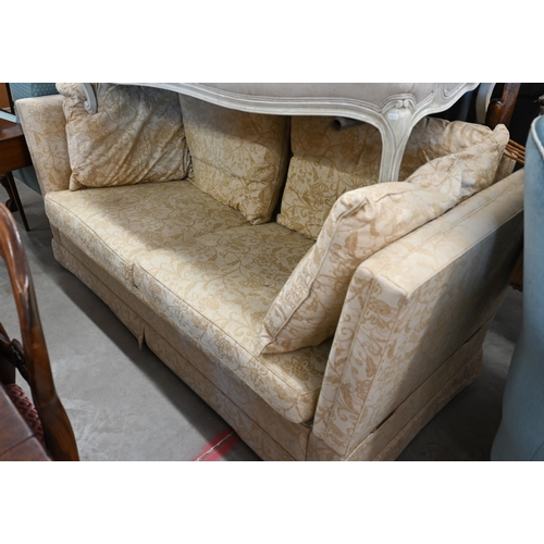 150 - A Knole two-seater sofa with old gold floral upholstery and turned hardwood finials, 192 x 90 x 100 ... 