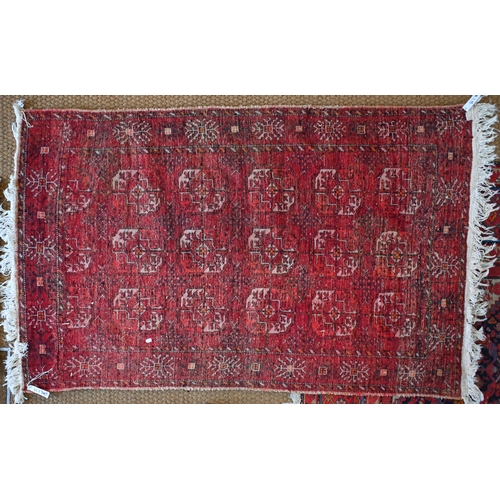 212 - A Persian Hamadan runner with five floral medallions on dark red ground, 333 x 89 cm to/w a Turkoman... 