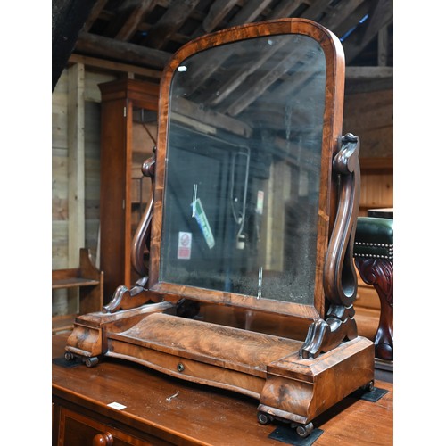 64 - A Victorian mahogany fold over double gateleg tea table, with single frieze drawer, raised on square... 