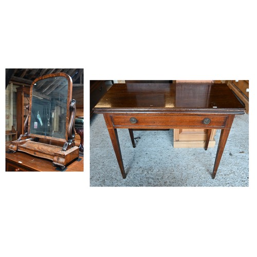 64 - A Victorian mahogany fold over double gateleg tea table, with single frieze drawer, raised on square... 