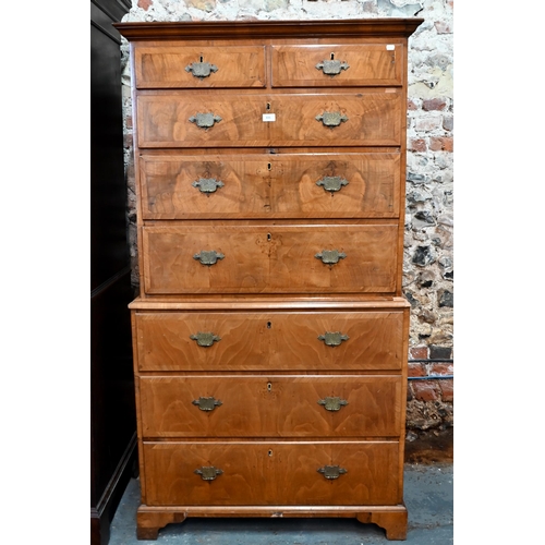 282 - An 18th century cross-banded walnut chest on chest, the moulded cornice over an arrangement of two s... 