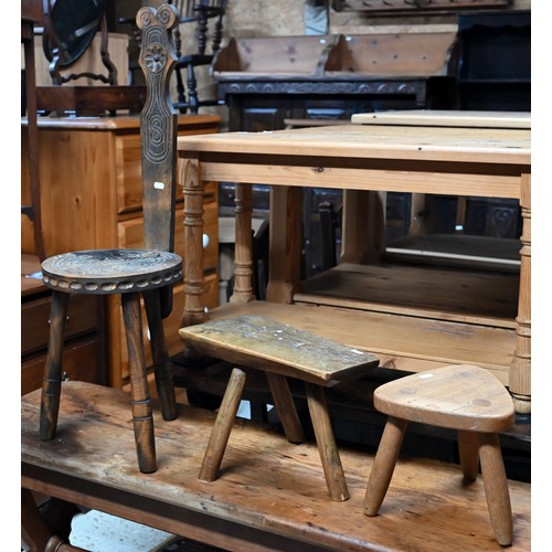 32A - Two three legged country stools and a part carved Welsh spinning stool (3)