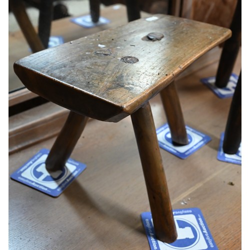 32A - Two three legged country stools and a part carved Welsh spinning stool (3)