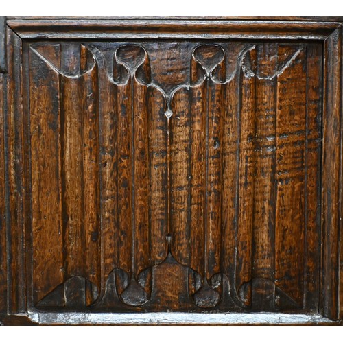 67 - An antique oak linenfold carved coffer, panelled construction with hinged top, 110 cm w x 50 cm d x ... 