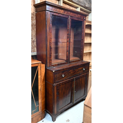 30 - # A Victorian mahogany secretaire bookcase, the pair of glazed-in doors over a fitted secretaire dra... 