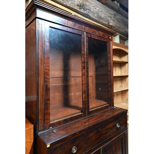 30 - A Victorian mahogany secretaire bookcase, the pair of glazed-in doors over a fitted secretaire drawe... 