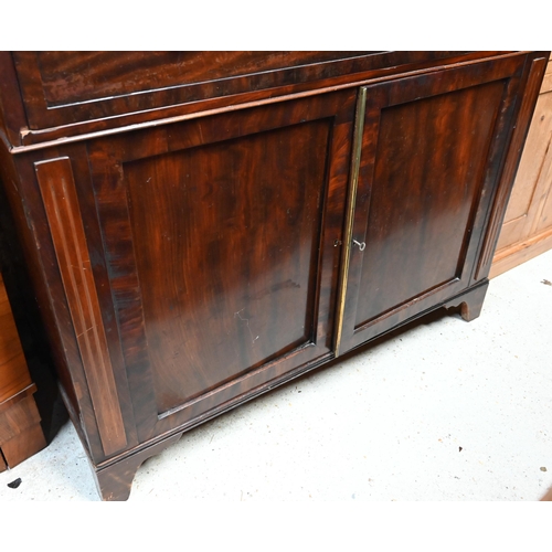 30 - # A Victorian mahogany secretaire bookcase, the pair of glazed-in doors over a fitted secretaire dra... 